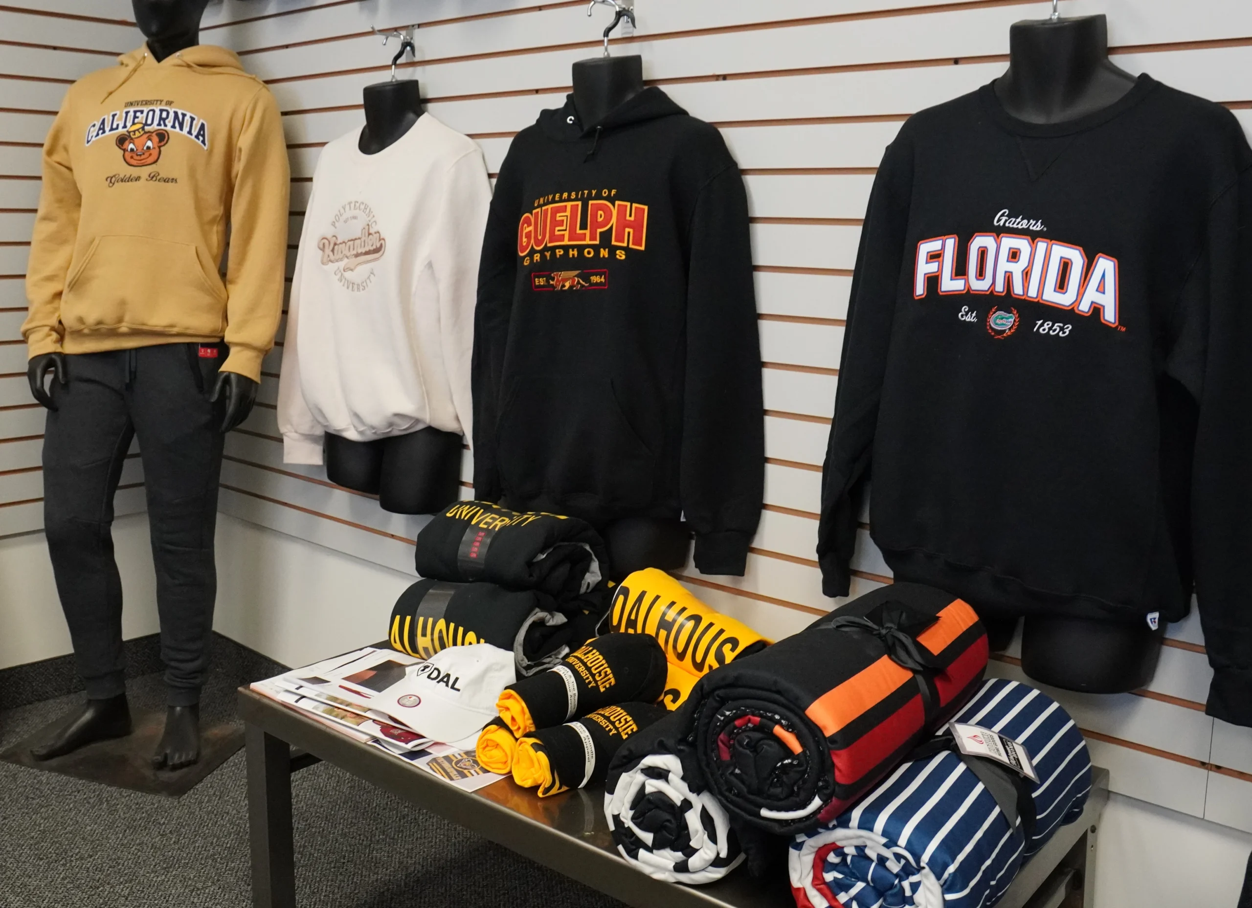 Store showcase with hoodies and t-shirts as custom printed clothing