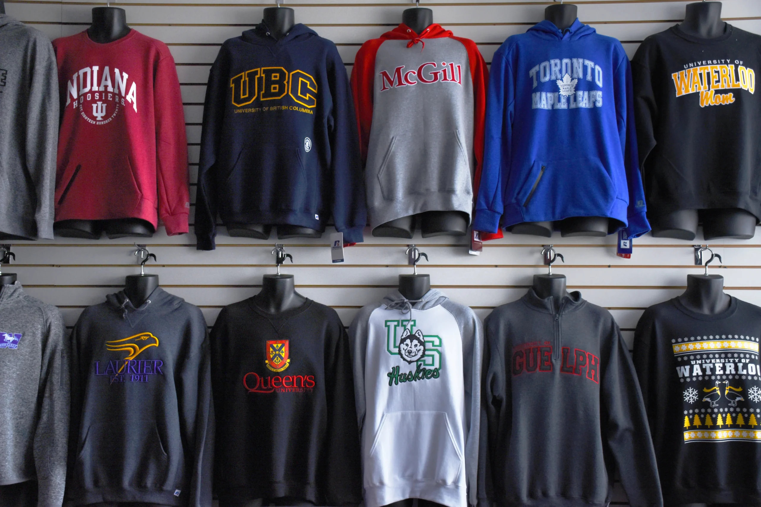 Wall display with hanging Brantford apparel on clothing racks