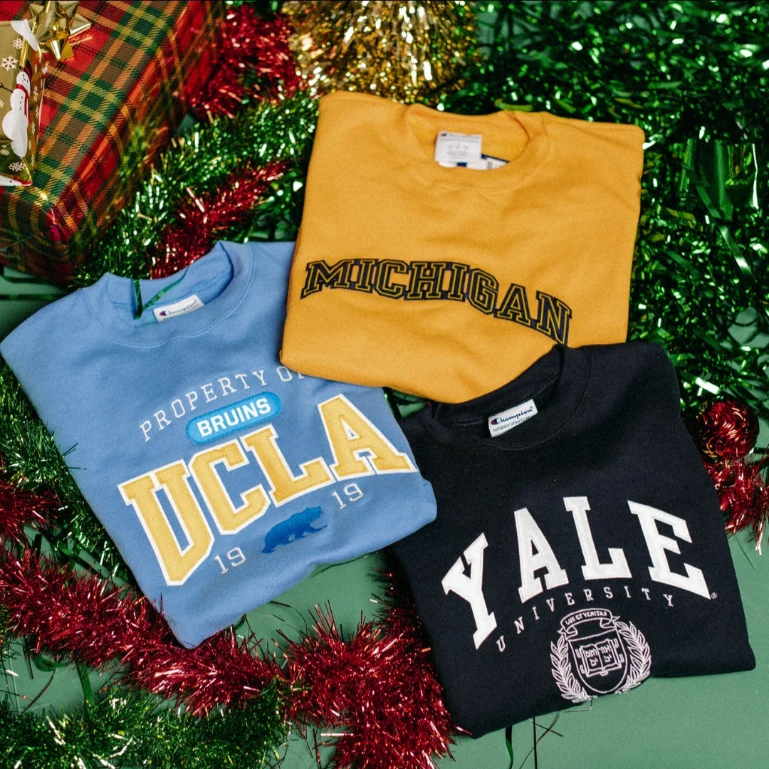Three t-shirts displayed with custom stitching details