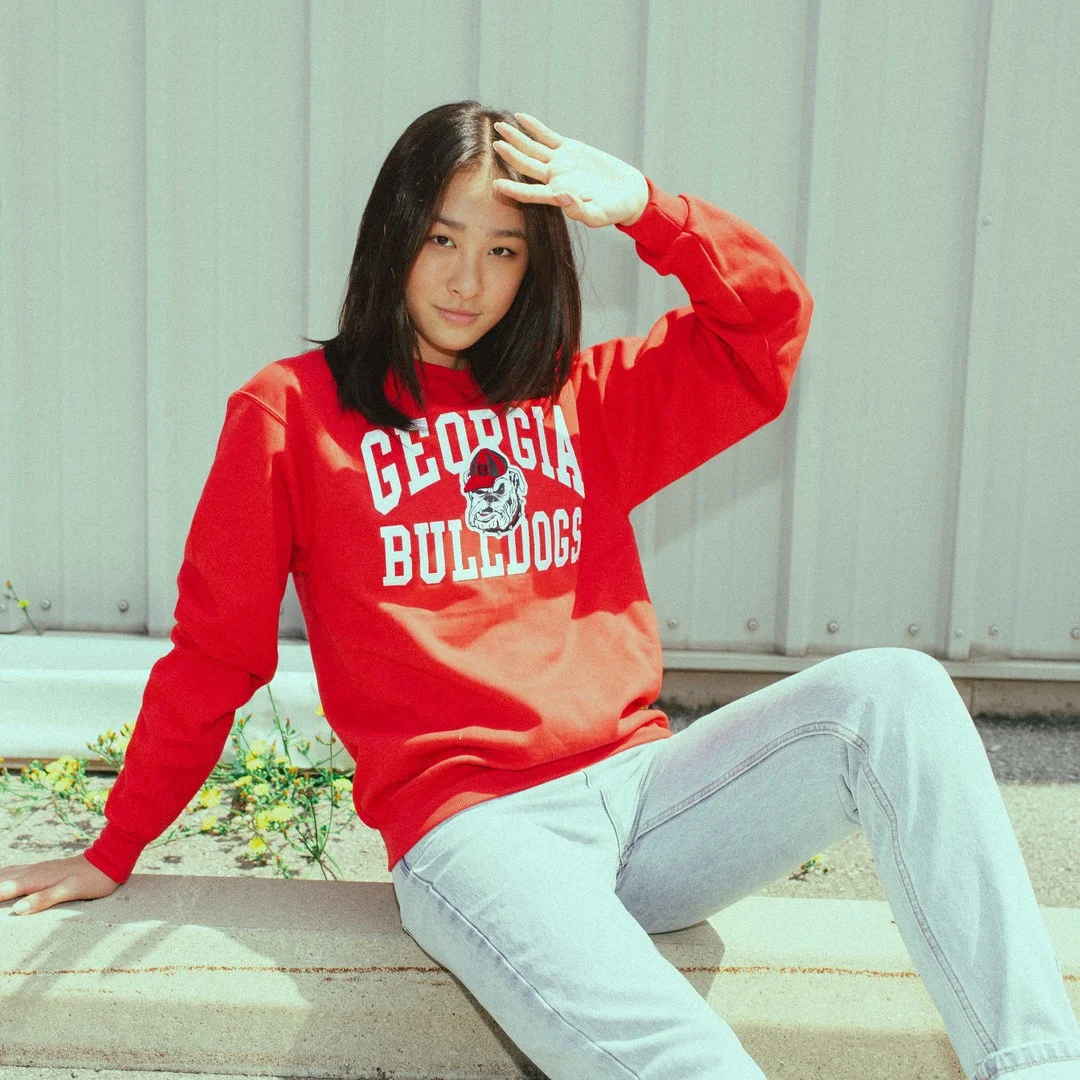 Woman in bright red hoodie featuring custom tshirt printing